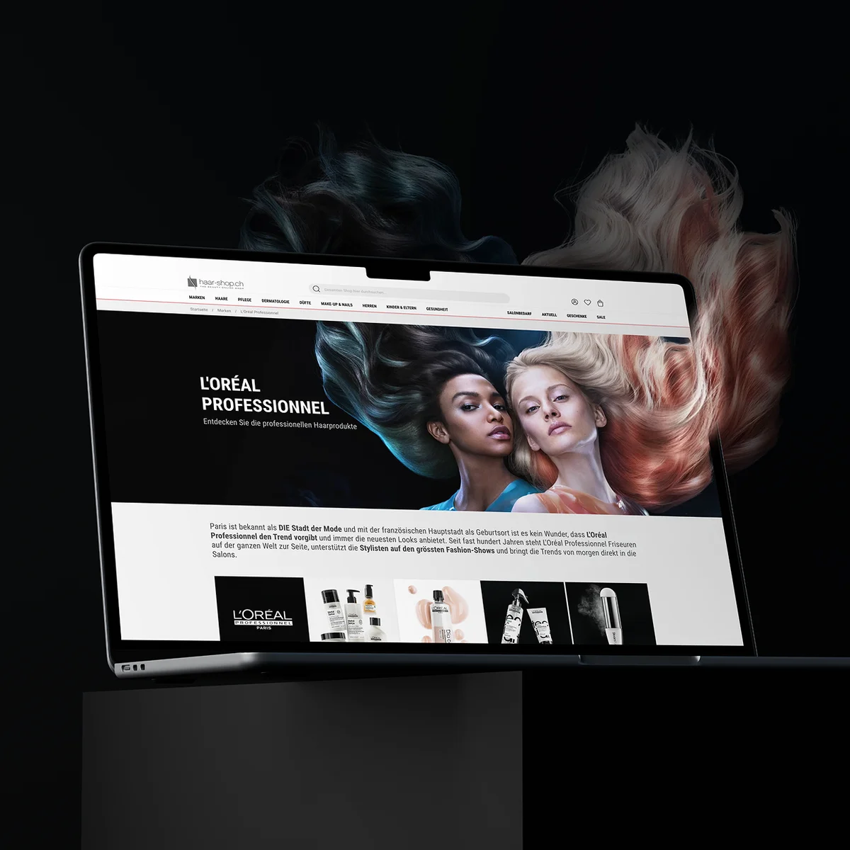 Podgląd strony e-commerce haar-shop.ch na laptopie prezentujący stronę marki „L'ORÉAL PROFESSIONNEL” z efektowną grafiką przedstawiającą modelki i lśniące, kolorowe włosy na ciemnym tle z artystycznymi dopinkami