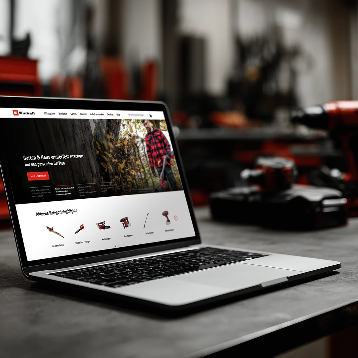 Podgląd strony e-commerce Einhell na laptopie prezentujący narzędzia ogrodowe i domowe