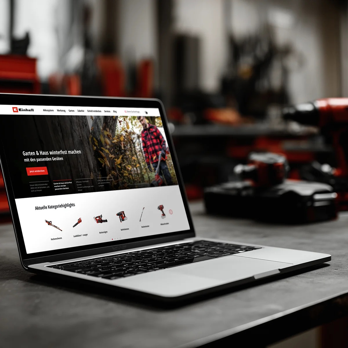 Podgląd strony e-commerce Einhell na laptopie prezentujący narzędzia ogrodowe i domowe